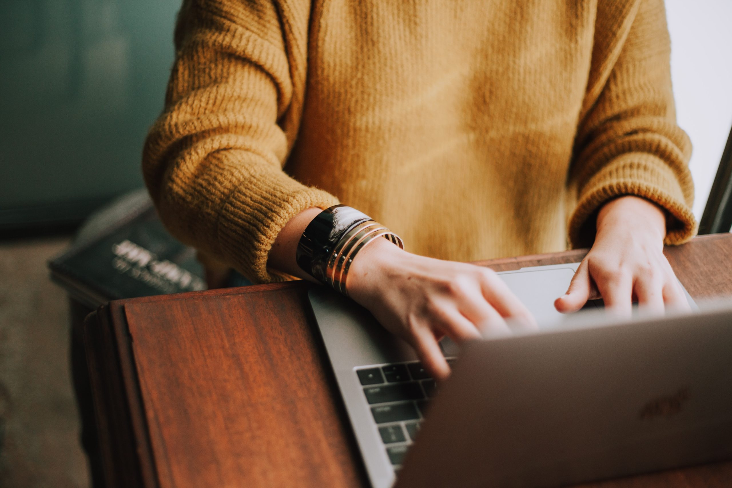 business owner typing on laptop